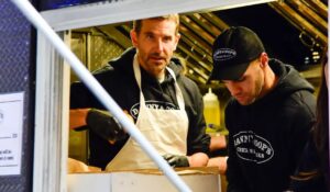 Bradley Cooper serving cheesesteaks to Super Bowl fans in New Orleans